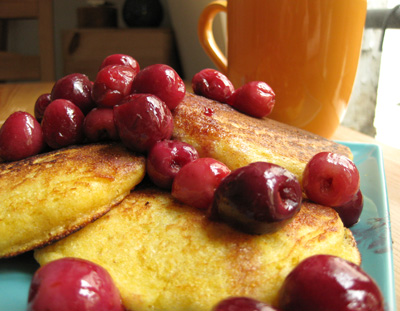 Cherries, heated with butter, sugar, and balsamico, over polenta pancakes
